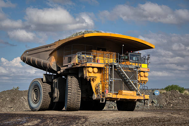electric mining truck at the diamond mine to reduce co2 emissions, clean energy from the new fleet driving into the open pit mine .